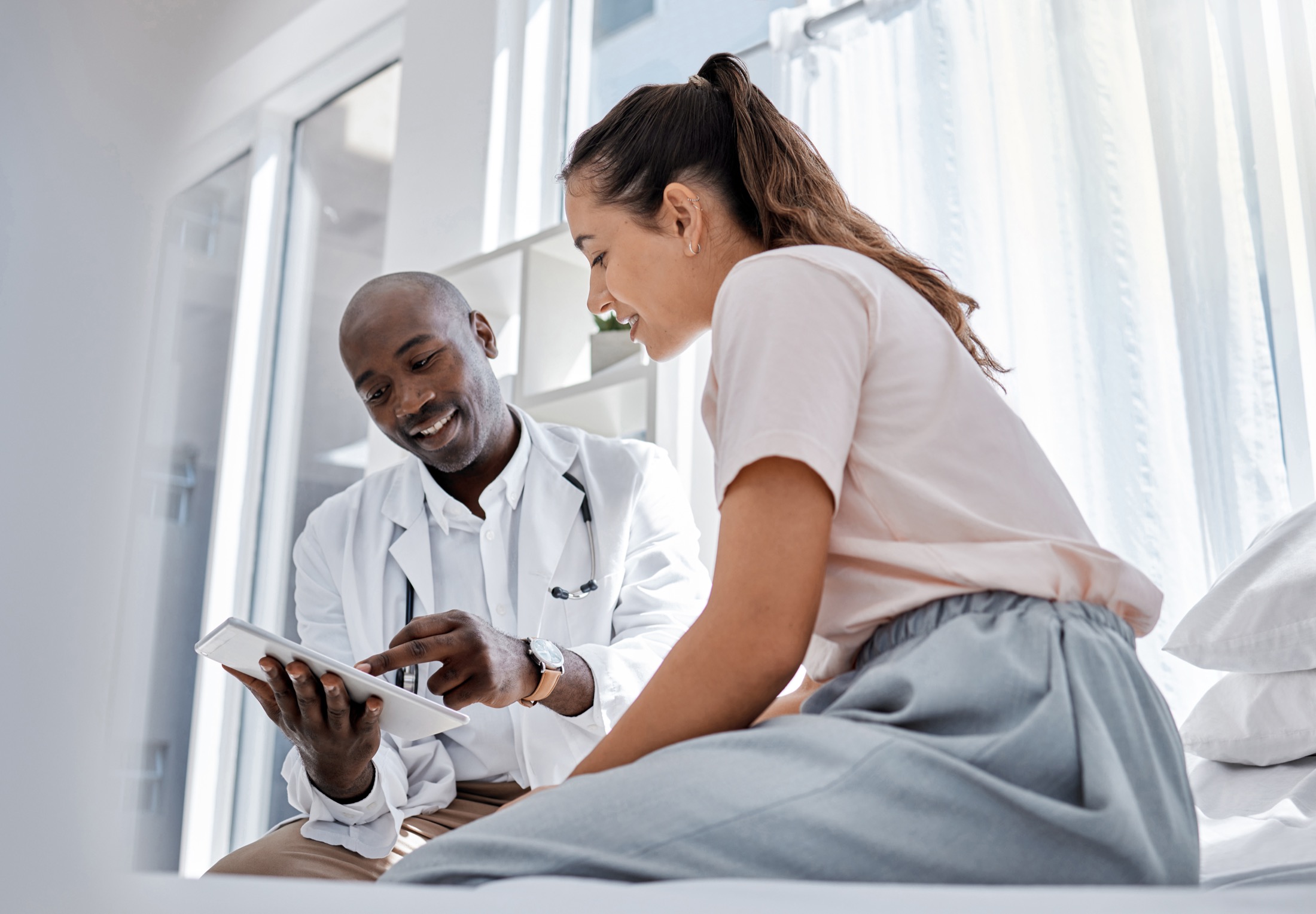 A physician reviewing health information with a patient